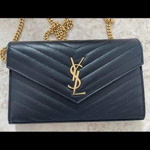 YSL CHAIN WALLET IN GRAIN DE POUDRE EMBOSSED LEATHER